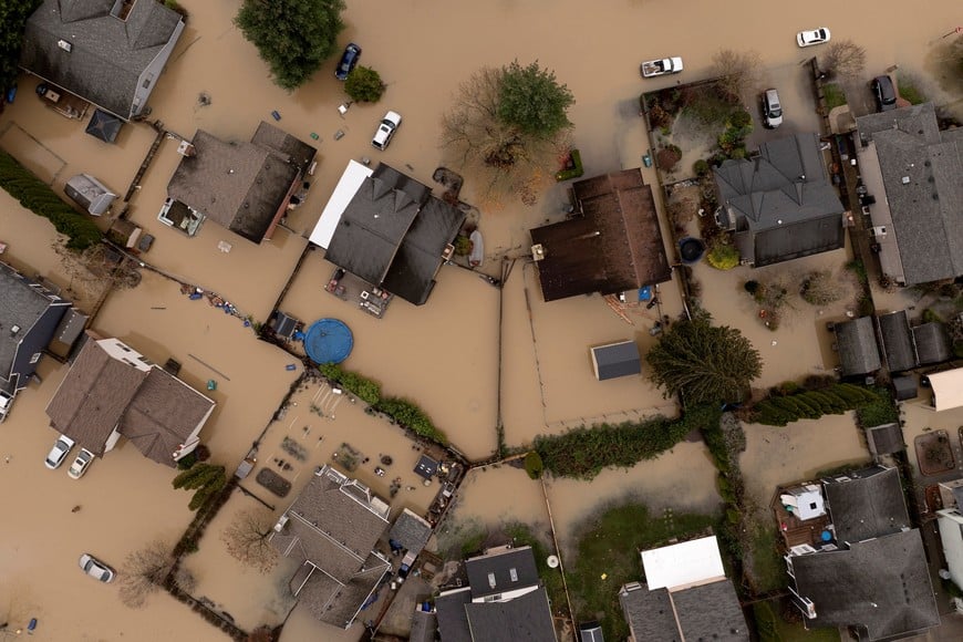 A drone view shows a neighborhood flooded by the failure of a temporary flood barrier along the White River, after multiple atmospheric rivers brought rain and flooding to the Pacific Northwest, in Pacific, Washington, U.S., December 16, 2025.  REUTERS/David Ryder