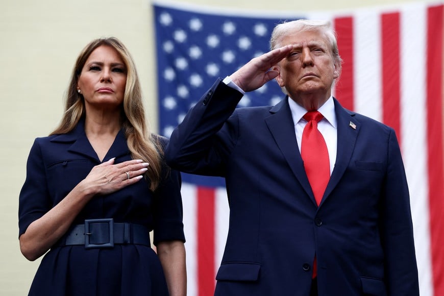 U.S. President Donald Trump and U.S. first lady Melania Trump gesture during a ceremony marking the 24th anniversary of the September 11, 2001, attacks on the United States at the Pentagon, in Washington D.C., U.S., September 11, 2025. REUTERS/Evelyn Hockstein     TPX IMAGES OF THE DAY