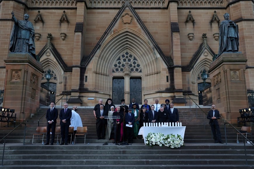 NSW Premier Chris Minns and Australian Prime Minister Anthony Albanese attend an interfaith memorial service for the victims of the shooting at a Hanukkah event at Bondi Beach, at St Mary’s Cathedral in Sydney, Australia, December 17, 2025. REUTERS/Hollie Adams