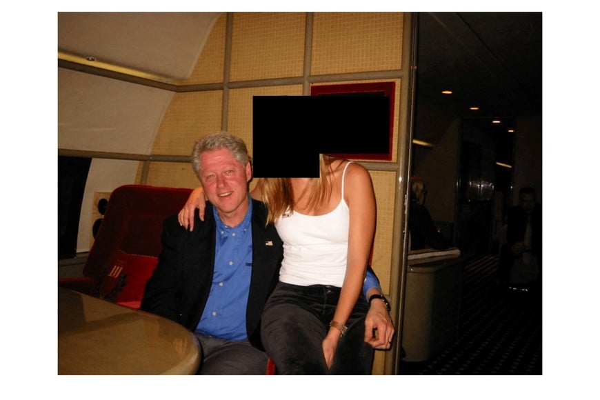 Former U.S. President Bill Clinton and a woman are seen in this image from the estate of late financier and convicted sex offender Jeffrey Epstein, released by the Department of Justice in Washington, D.C., U.S., on December 19, 2025. U.S. Justice Department/Handout via REUTERS   THIS IMAGE HAS BEEN SUPPLIED BY A THIRD PARTY REDACTED AREAS FROM SOURCE.