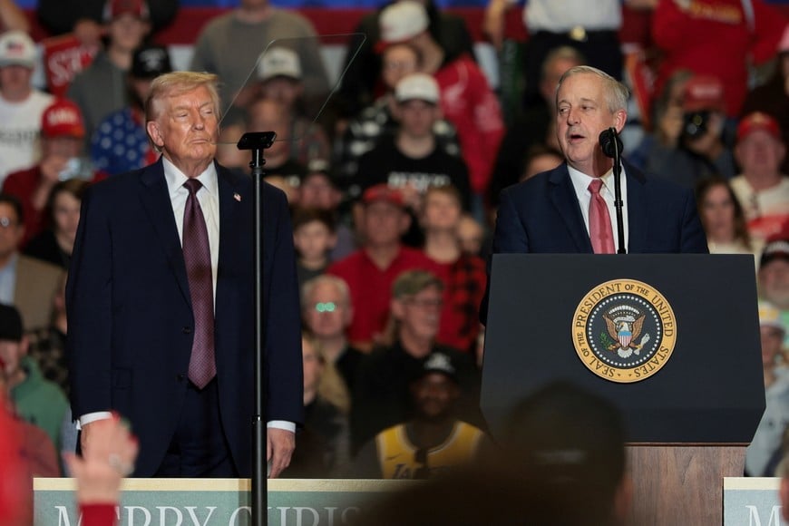 Michael Whatley, a Republican candidate for the U.S. Senate from North Carolina, speaks at an event as he stands next to U.S. President Donald Trump, at Rocky Mount Event Center in Rocky Mount, North Carolina, U.S., December 19, 2025. REUTERS/Jessica Koscielniak