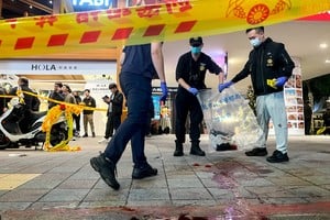 SENSITIVE MATERIAL. THIS IMAGE MAY OFFEND OR DISTURB
Police collect evidence from a crime scene outside Eslite Spectrum Nanxi store near Zhongshan station as the entrance of the building is cordoned off with yellow crime scene tape, following an incident in which several were injured after a person released smoke bombs and attacked bystanders, according to the government and local media, in Taipei, Taiwan, December 19, 2025. REUTERS/Ann Wang