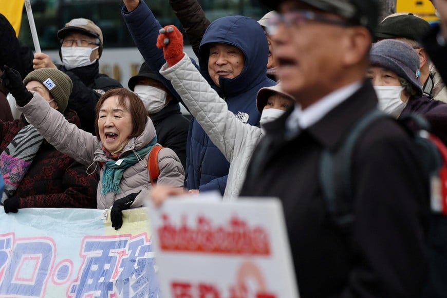 Protesters take part in a rally near Niigata prefectural government office building before voting takes place in the prefectural assembly on a partial restart of the Tokyo Electric Power Company's (TEPCO) Kashiwazaki Kariwa Nuclear Power Plant, one of the world's largest nuclear power plants and which was among the reactors shut after a massive earthquake and tsunami in 2011 crippled TEPCO's Fukushima Daiichi plant, in Niigata, Japan December 22, 2025.  REUTERS/Issei Kato