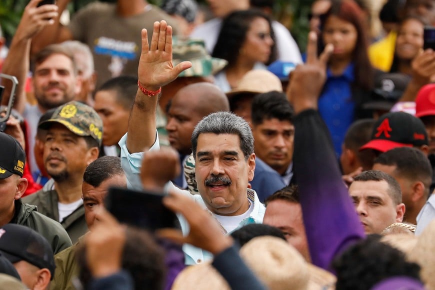 Venezuela's President Nicolas Maduro gestures, as he joins his supporters during a march to commemorate the Battle of Santa Ines, on the same day Venezuelan opposition leader Maria Corina Machado was awarded the 2025 Nobel Peace Prize in Norway, in Caracas, Venezuela, December 10, 2025. REUTERS/Leonardo Fernandez Viloria