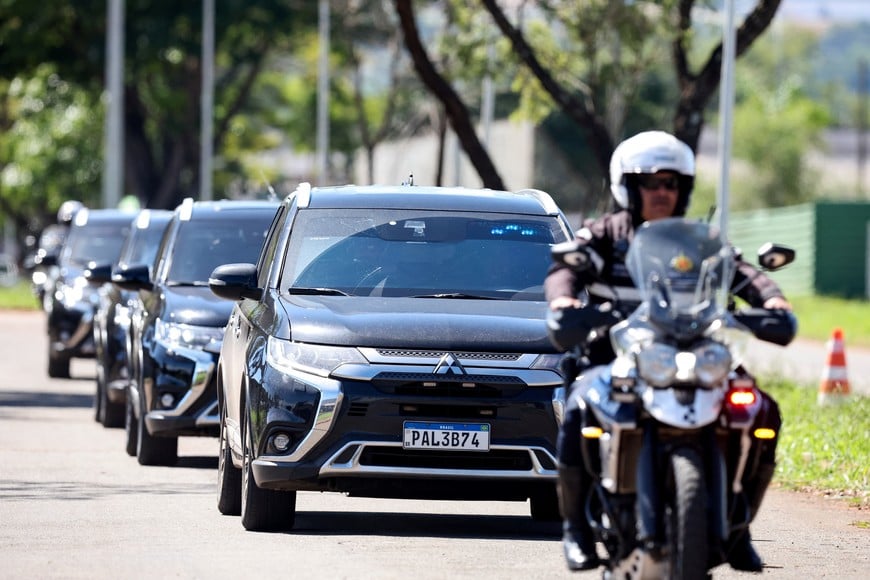 Motorcade of Brazil's former President Jair Bolsonaro leaves a Federal Police building, as Bolsonaro travels to a hospital for surgery to treat a hernia, as he is serving a 27-year sentence for plotting a coup against his successor, President Luiz Inacio Lula da Silva, in Brasilia, Brazil, December 24, 2025. REUTERS/Mateus Bonomi