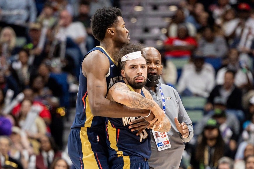 Dec 27, 2025; New Orleans, Louisiana, USA;  New Orleans Pelicans guard Jose Alvarado (15) gets into a scrum with Phoenix Suns center Mark Williams (not pictured) over a play during the second half at Smoothie King Center. Mandatory Credit: Stephen Lew-Imagn Images