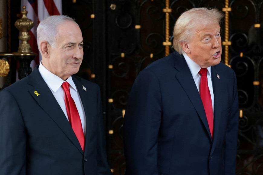 U.S. President Donald Trump speaks next to Israeli Prime Minister Benjamin Netanyahu upon arrival for meetings at Trump's Mar-a-Lago club in Palm Beach, Florida, U.S., December 29, 2025. REUTERS/Jonathan Ernst