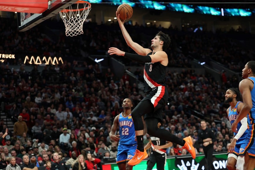 Nov 5, 2025; Portland, Oregon, USA;  Portland Trail Blazers forward Deni Avdija (8) shoots the ball against the Oklahoma City Thunder during the second half at Moda Center. Mandatory Credit: Jaime Valdez-Imagn Images