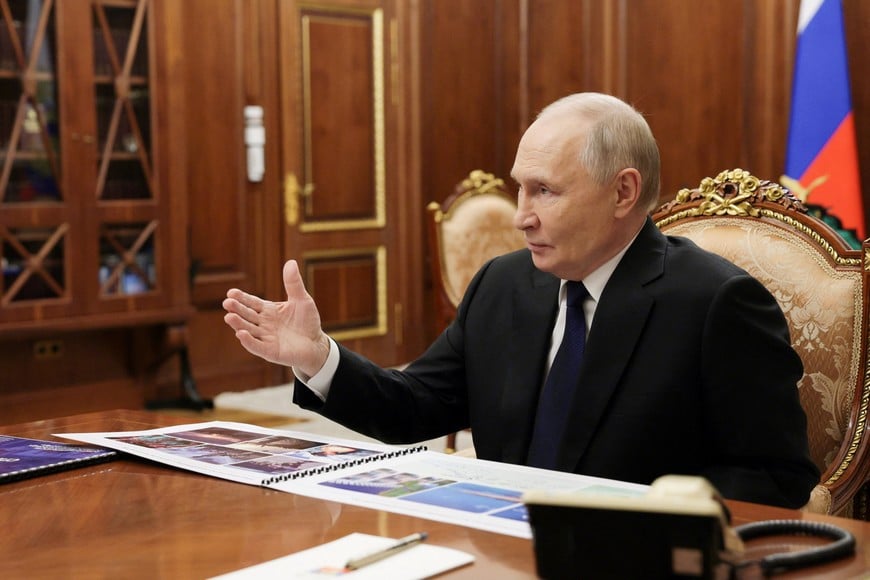 Russia's President Vladimir Putin attends a meeting with Deputy Minister of Defence and Chair of Defenders of the Fatherland Foundation Anna Tsivileva in Moscow, Russia, December 30, 2025. Sputnik/Mikhail Metzel/Pool via REUTERS ATTENTION EDITORS - THIS IMAGE WAS PROVIDED BY A THIRD PARTY.