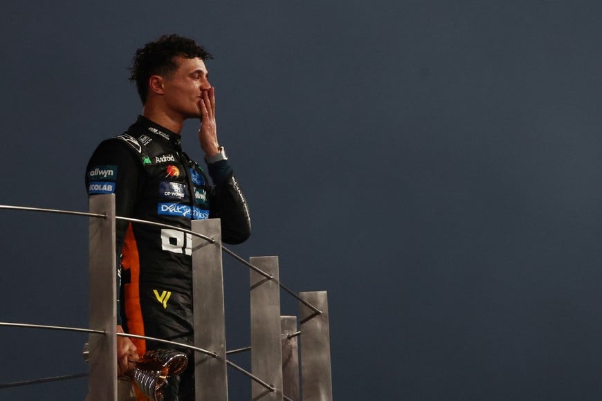 Formula One F1 - Abu Dhabi Grand Prix - Yas Marina Circuit, Abu Dhabi, United Arab Emirates - December 7, 2025
McLaren's Lando Norris celebrates on the podium after becoming the 2025 Formula One World Champion REUTERS/Jakub Porzycki
