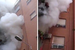 Densa nube de humo en un edificio de Paiporta, en Valencia.