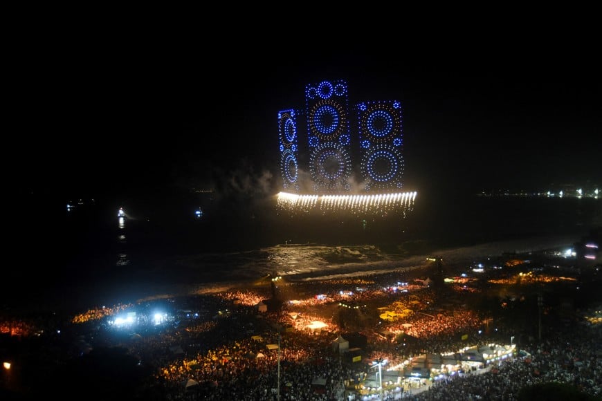 Drones make a formation during New Year's celebrations at the Copacabana beach in Rio de Janeiro, Brazil, January 1, 2026. REUTERS/Tita Barros