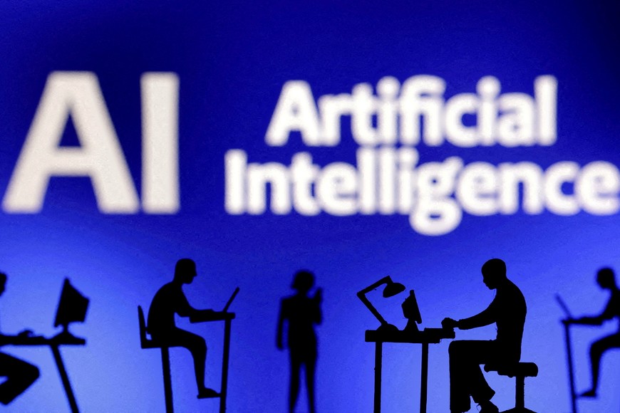 FILE PHOTO: Figurines with computers and smartphones are seen in front of the words "Artificial Intelligence AI" in this illustration created on February 19, 2024. REUTERS/Dado Ruvic/Illustration/File Photo