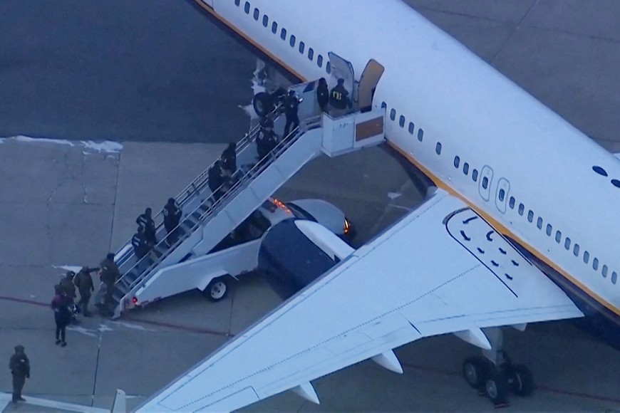 Federal agents board an aircraft carrying Venezuela's President Nicolas Maduro before they lead him out in custody ahead of his scheduled court appearance at Manhattan federal court, at Stewart Air National Guard Base in Newburgh, New York, U.S. January 3, 2026.  ABC Affiliate WABC via REUTERS 
NO RESALES. NO ARCHIVES. THIS IMAGE HAS BEEN SUPPLIED BY A THIRD PARTY. MANDATORY CREDIT