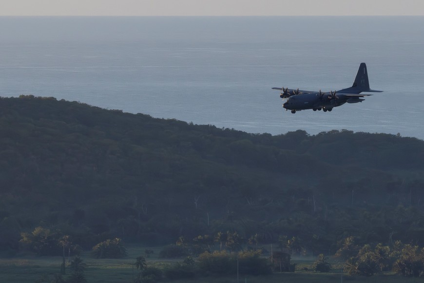 A U.S. Coast Guard HC-130J aircraft approaches for landing at the former Roosevelt Roads naval base, after U.S. President Donald Trump said the U.S. has struck Venezuela and captured its President Nicolas Maduro and his wife Cilia Flores, in Ceiba, Puerto Rico, January 3, 2026. REUTERS/Eva Marie Uzcategui