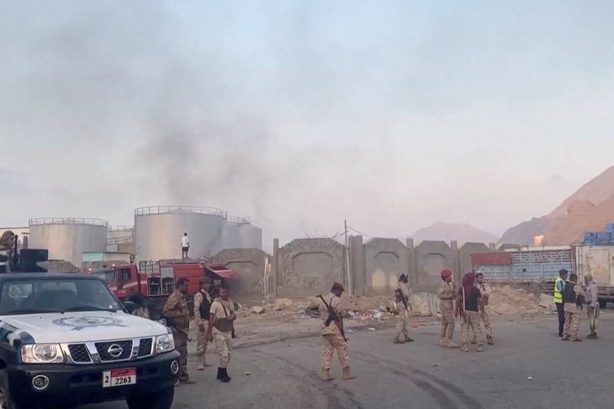 Smoke rises in the aftermath of a Saudi-led coalition airstrike, which targeted what it described as foreign military support to UAE-backed southern separatists, in Yemen's southern port of Mukalla, in this screengrab from a handout video obtained by Reuters on December 30, 2025. SABAA TV/Handout via REUTERS    THIS IMAGE HAS BEEN SUPPLIED BY A THIRD PARTY. 

VERIFICATION LINES: Reuters was able to confirm the location from the layout of the storage tanks, warehouses and trees which matched satellite imagery and corroborating footage from the scene. The date when the video was filmed was confirmed by official and media reports.     TPX IMAGES OF THE DAY