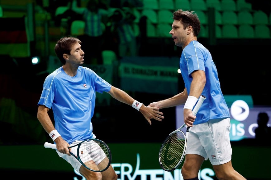 Tennis - Davis Cup - Final 8 - Argentina v Germany - SuperTennis Arena, Bologna, Italy - November 20, 2025  
Argentina's Andres Molteni and Argentina's Horacio Zeballos shake hands during their doubles match against Germany's Kevin Krawietz and Germany's Tim Puetz REUTERS/Alessandro Garofalo