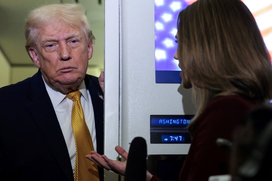 U.S. President Donald Trump listens to a reporter’s question aboard Air Force One en route from Florida to Joint Base Andrews, Maryland, U.S., January 4, 2026. REUTERS/Jonathan Ernst