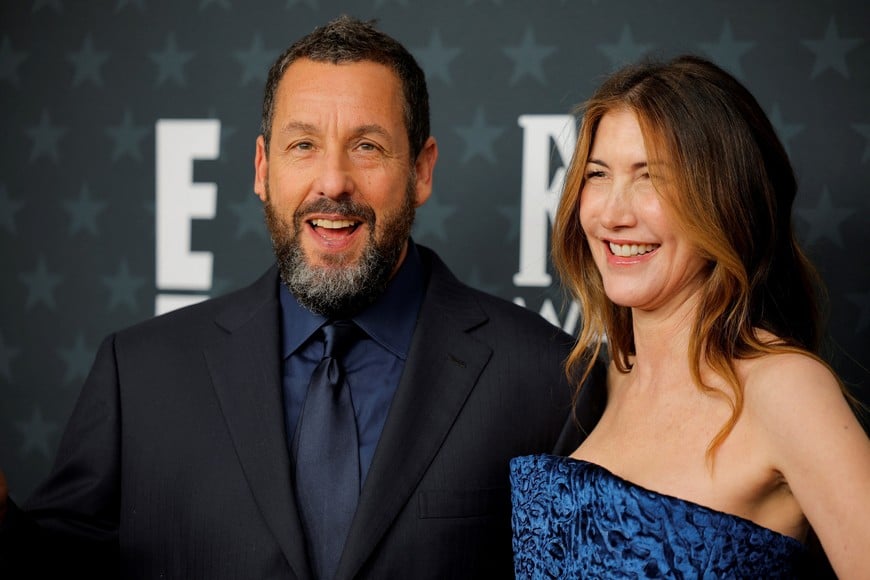 Adam Sandler and Jackie Sandler attend the 31st annual Critics Choice Awards in Santa Monica, California, U.S., January 4, 2026. REUTERS/Mike Blake