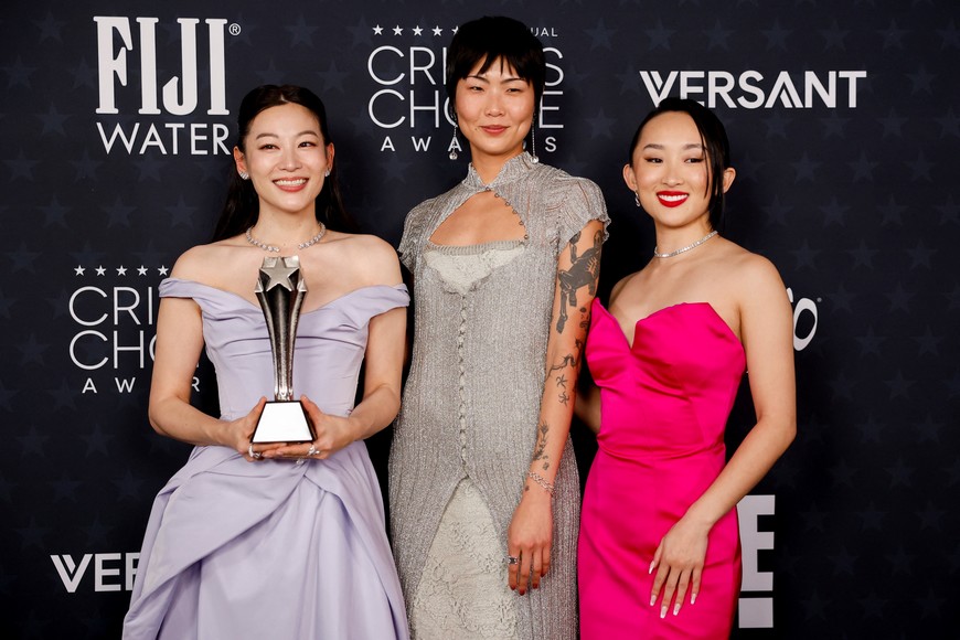 Arden Cho, May Hong and Ji-young Yoo pose with Best Animated Feature award for "KPop Demon Hunters" during the 31st Annual Critics Choice Awards in Santa Monica, California, U.S., January 4, 2026. REUTERS/Caroline Brehman