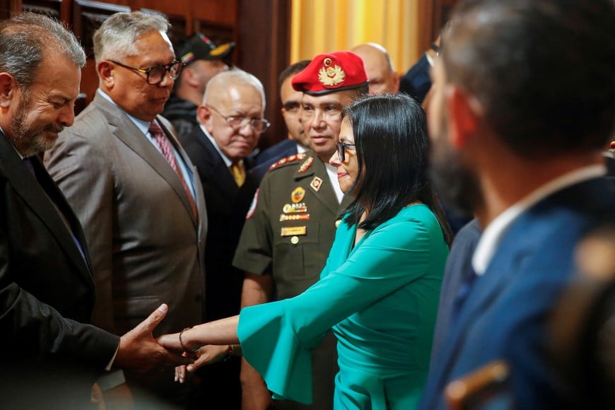 Venezuela’s interim president Delcy Rodriguez greets legislators following her swearing-in ceremony at the National Assembly, after the U.S. launched a strike on the country and deposed Nicolas Maduro and his wife Cilia Flores, in Caracas, Venezuela, January 5, 2026. REUTERS/Leonardo Fernandez Viloria