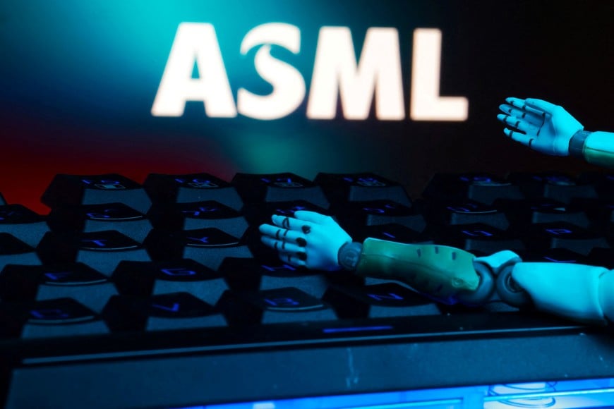 The ASML logo, a keyboard, and robot hands are seen in this illustration taken January 27, 2025. REUTERS/Dado Ruvic/Illustration