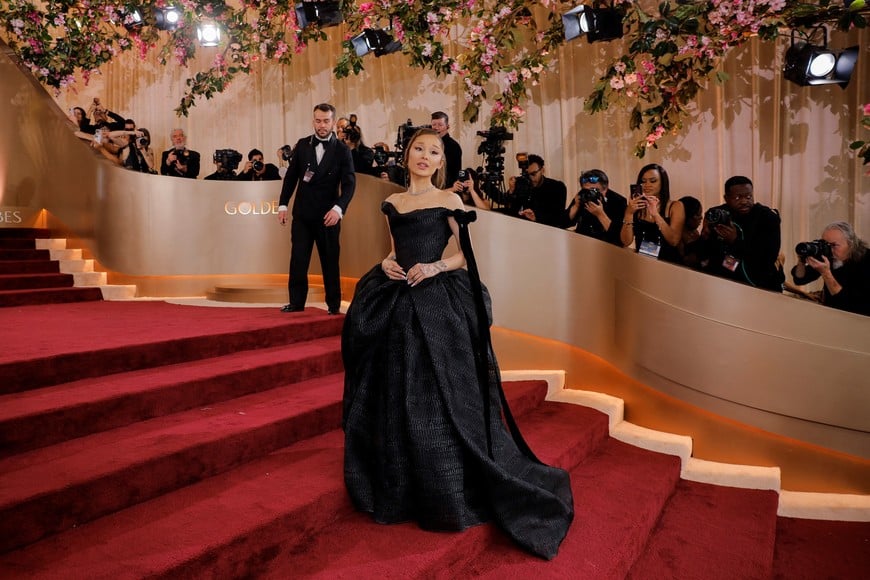 Ariana Grande poses on the red carpet at the 83rd Annual Golden Globes in Beverly Hills, California, U.S., January 11, 2026. REUTERS/Mike Blake