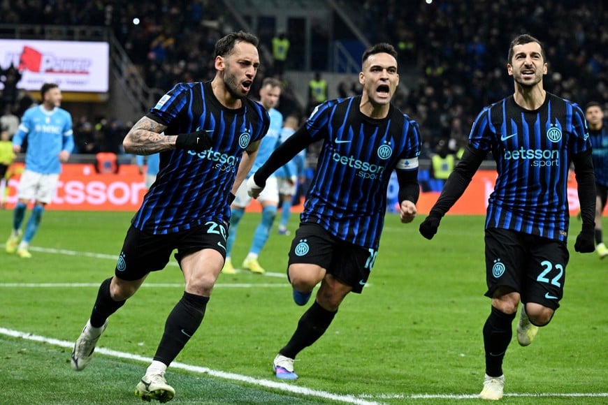 Soccer Football - Serie A - Inter Milan v Napoli - San Siro, Milan, Italy - January 11, 2026
Inter Milan's Hakan Calhanoglu celebrates scoring their second goal with Lautaro Martinez and Henrikh Mkhitaryan REUTERS/Jennifer Lorenzini TPX IMAGES OF THE DAY