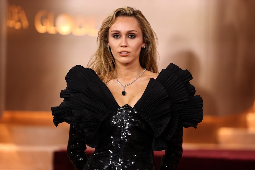 Miley Cyrus poses on the red carpet at the 83rd Annual Golden Globes in Beverly Hills, California, U.S., January 11, 2026. REUTERS/Daniel Cole