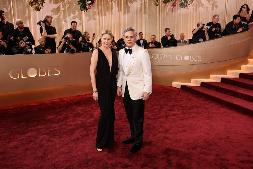 Mark Ruffalo and Sunrise Coigney pose on the red carpet at the 83rd Annual Golden Globes in Beverly Hills, California, U.S., January 11, 2026. REUTERS/Daniel Cole