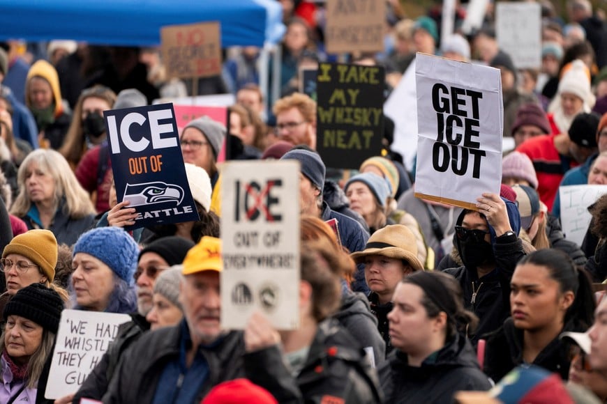 People gather for a protest against increased immigration enforcement, after Renee Nicole Good was fatally shot in Minneapolis by a U.S. Immigration and Customs Enforcement (ICE) agent, in Seattle, Washington, U.S. January 11, 2026.  REUTERS/David Ryder