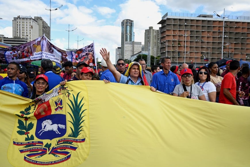 Demonstrators attend a march organized by Venezuelan transport workers in support of captured President Nicolas Maduro and his wife Cilia Flores, over a week after the U.S. launched a strike on the country, in Caracas, Venezuela January 13, 2026. REUTERS/Maxwell Briceno