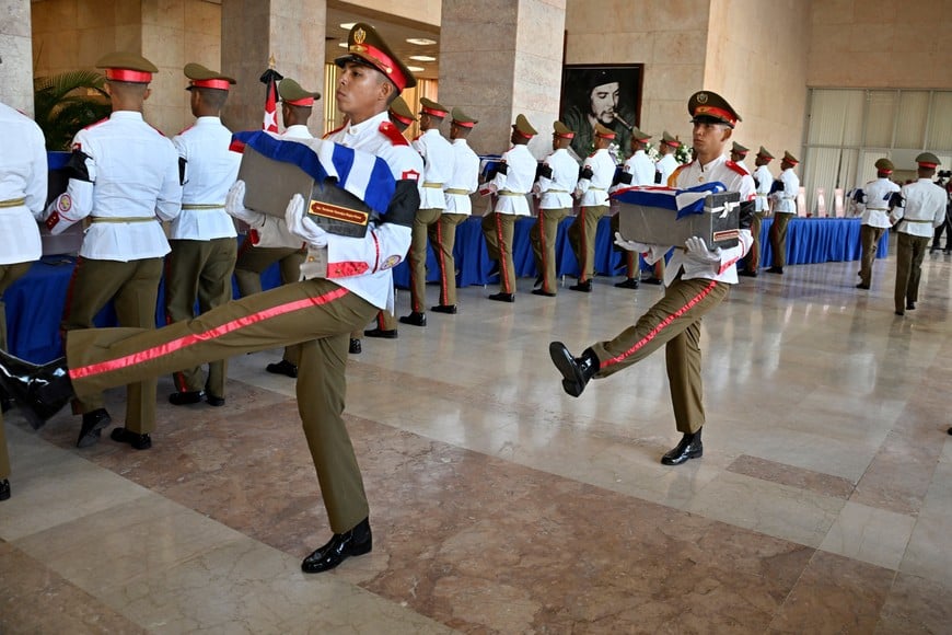 Members of the Cuban military honor guard carry Cuban-flag-draped urns of soldiers killed in the U.S. strike and the capture of President Nicolas Maduro and his wife, Cilia Flores, in Caracas on January 3, as Cuba pays tribute, in Havana, Cuba January 15, 2026. Adalberto Roque/Pool via REUTERS