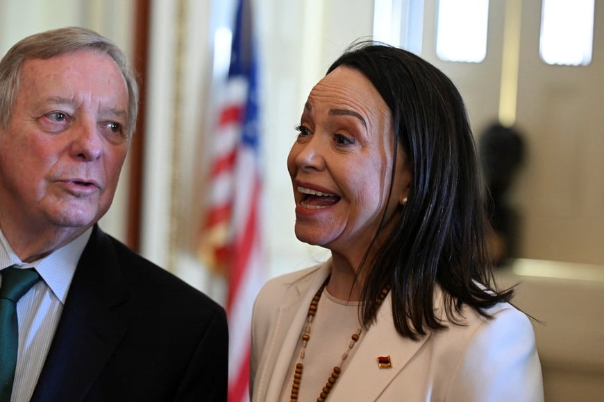 Venezuelan opposition leader Maria Corina Machado stands with U.S. Senators Dick Durbin (D-IL) as she meets U.S. senators after her meeting with U.S. President Donald Trump at the White House, on Capitol Hill in Washington, D.C., U.S., January 15, 2026. REUTERS/Annabelle Gordon