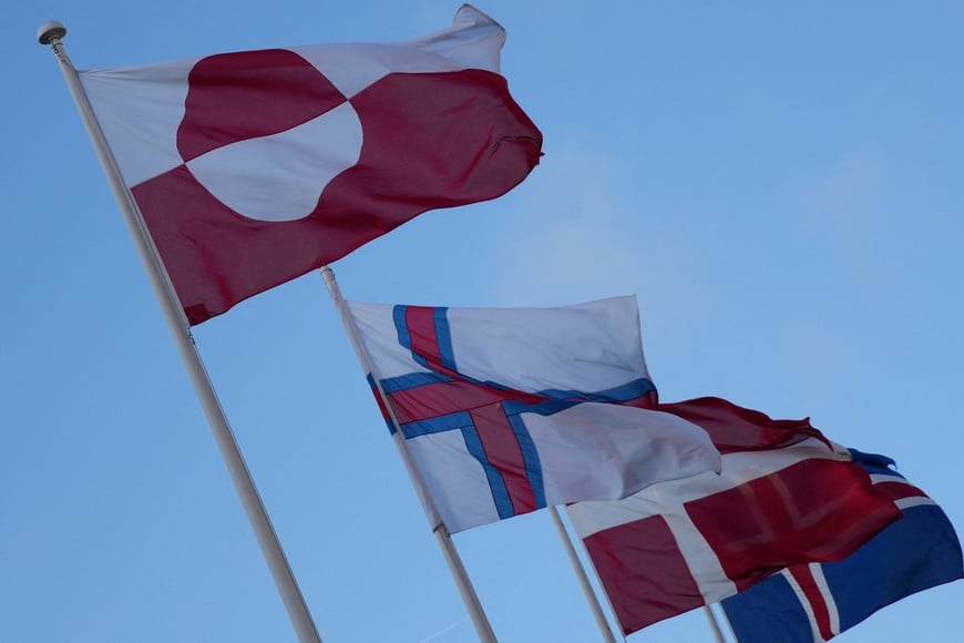 The flags of Greenland, the Faroe Islands, Denmark and Iceland flutter outside North Atlantic House in Copenhagen, Denmark, January 14, 2026. REUTERS/Tom Little