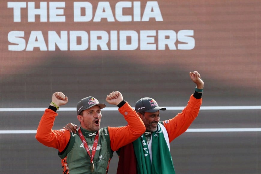 Rallying - Dakar Rally - Stage 13 - Yanbu to Yanbu - Yanbu, Saudi Arabia - January 17, 2026
Dacia's Nasser Al-Attiyah and Fabian Lurquin celebrate on the podium with their medals after winning the car category REUTERS/Stephane Mahe