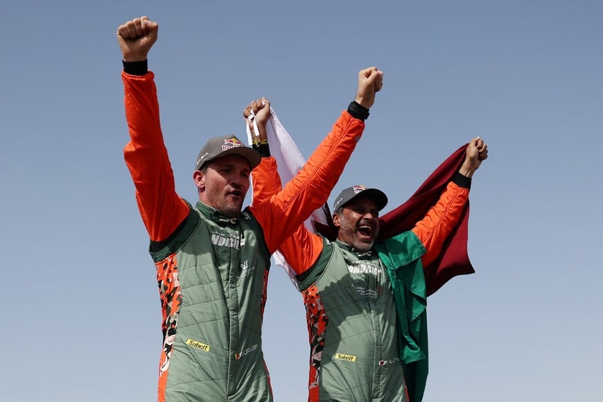 Rallying - Dakar Rally - Stage 13 - Yanbu to Yanbu - Yanbu, Saudi Arabia - January 17, 2026
Dacia's Nasser Al-Attiyah and Fabian Lurquin celebrate after winning in the car category REUTERS/Stephane Mahe