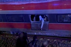 A person exits a derailed train as first responders search through wreckage after two high-speed trains derailed in Adamuz, near Cordoba, Spain, January 18, 2026. @eleanorinthesky via X/Handout via REUTERS    THIS IMAGE HAS BEEN SUPPLIED BY A THIRD PARTY. NO RESALES. NO ARCHIVES.

VERIFICATION LINE:?Reuters was able to confirm the location by comparing corroborating visuals. Reuters was able to confirm the date through corroborating reports. Location and train model confirmed through corroborating visuals and file imagery. Date confirmed through corroborating reports.