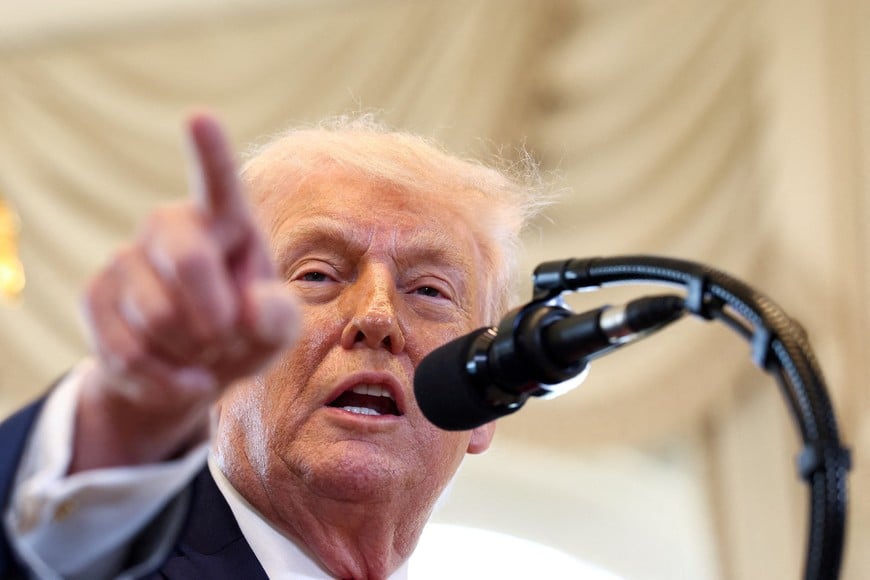 FILE PHOTO: U.S. President Donald Trump speaks at a ceremony held to dedicate a 4-mile stretch of road from West Palm Beach Airport to his Mar-a-Lago estate as 'President Donald J. Trump Boulevard', at the Mar-a-Lago estate in Palm Beach,  Florida, U.S., January 16, 2026.  REUTERS/Kevin Lamarque/File Photo