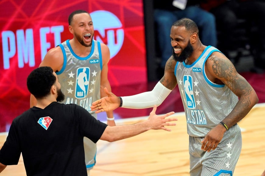 Feb 20, 2022; Cleveland, Ohio, USA; Team LeBron forward LeBron James celebrates after making the game winning shot with Team LeBron guard Stephen Curry (30) and Team LeBron guard Fred VanVleet (23) during the 2022 NBA All-Star Game at Rocket Mortgage FieldHouse. Mandatory Credit: David Richard-USA TODAY Sports