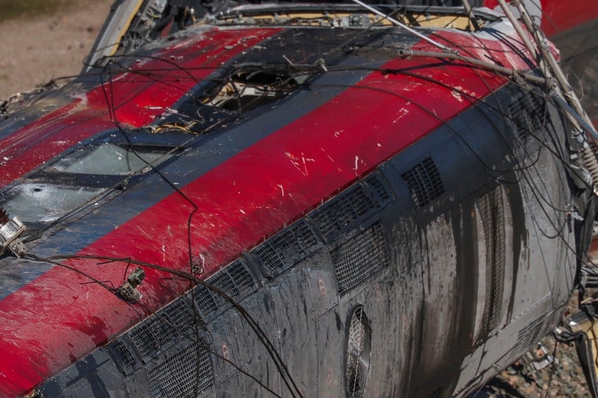Members of the Spanish Civil Guard, along with other emergency personnel, work next to one of the trains involved in the accident, at the site of a deadly derailment of two high-speed trains near Adamuz, in Cordoba, Spain, January 19, 2026. REUTERS/Susana Vera