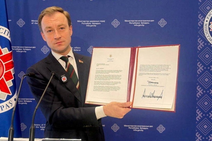 Belarus' Foreign Ministry spokesman Ruslan Varankov shows a letter from U.S. President Donald Trump inviting Belarus' President Alexander Lukashenko to join the "Board of Peace", during a meeting in Minsk, Belarus, in this image released January 19, 2026.  Belarus Foreign Ministry/Handout via REUTERS  ATTENTION EDITORS - THIS IMAGE WAS PROVIDED BY A THIRD PARTY. NO RESALES. NO ARCHIVES. MANDATORY CREDIT.