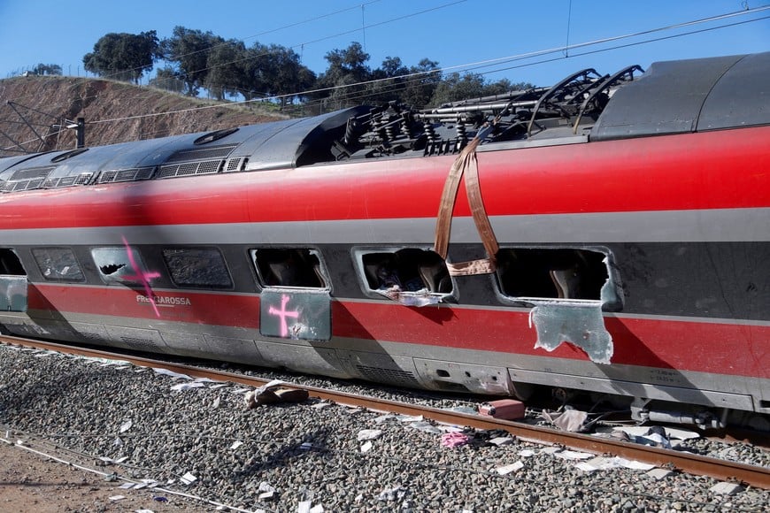 FILE PHOTO: Wreckage of a train involved in the accident, at the site of a deadly derailment of two high-speed trains near Adamuz, in Cordoba, Spain, January 20, 2026. REUTERS/Alex Gallegos/File Photo