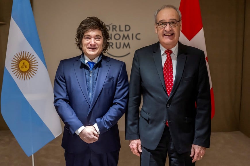 Argentina's President Javier Milei poses with Switzerland's Federal President Guy Parmelin, prior to a bilateral meeting on the sideline of the 56th annual meeting of the World Economic Forum, WEF, in Davos, Switzerland, Wednesday, January 21, 2026. Laurent Gillieron/Pool via REUTERS