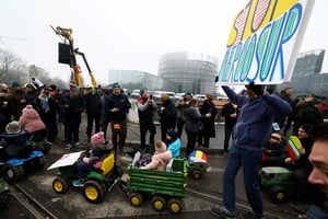 Children ride toy tractors during a farmers' protest as the European Parliament votes on Wednesday on whether to refer the EU-Mercosur trade agreement to the Court of Justice of the European Union (CJEU), in Strasbourg, France, January 21, 2026. REUTERS/Yves Herman