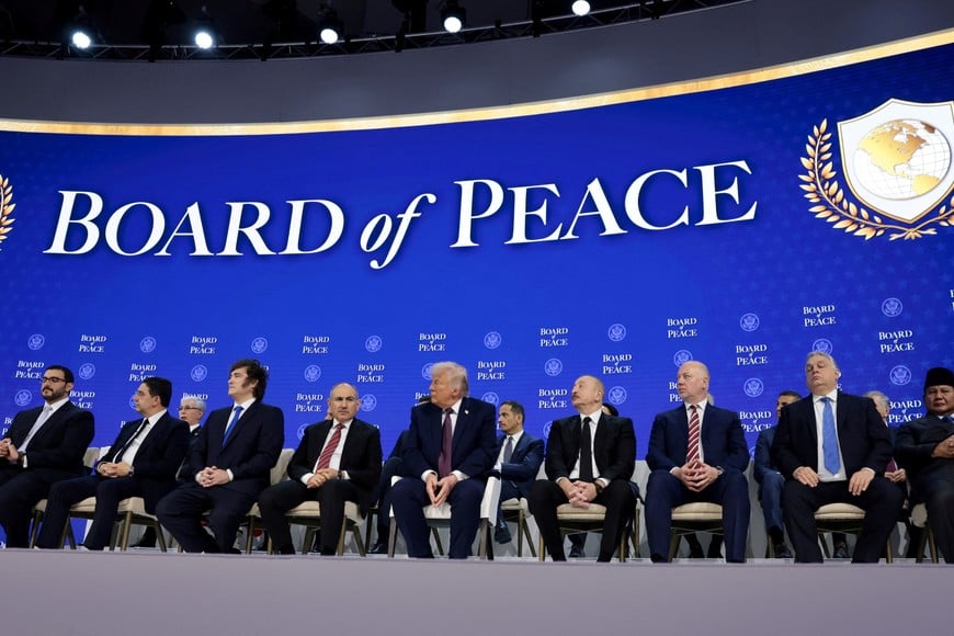 U.S. President Donald Trump sits with Argentina's President Javier Milei, Armenia's Prime Minister Nikol Pashinyan, Hungary's Prime Minister Viktor Orban, Bahrain's Minister of the Prime Minister's Court Shaikh Isa bin Salman bin Hamad Al Khalifa, Morocco's Foreign Minister Nasser Bourita, Azerbaijan's President Ilham Aliyev, Bulgaria's Prime Minister Rosen Zhelyazkov, and Indonesia's President Prabowo Subianto, during a charter announcement for Trump's Board of Peace initiative aimed at resolving global conflicts, alongside the 56th annual World Economic Forum (WEF), in Davos, Switzerland, January 22, 2026. REUTERS/Jonathan Ernst