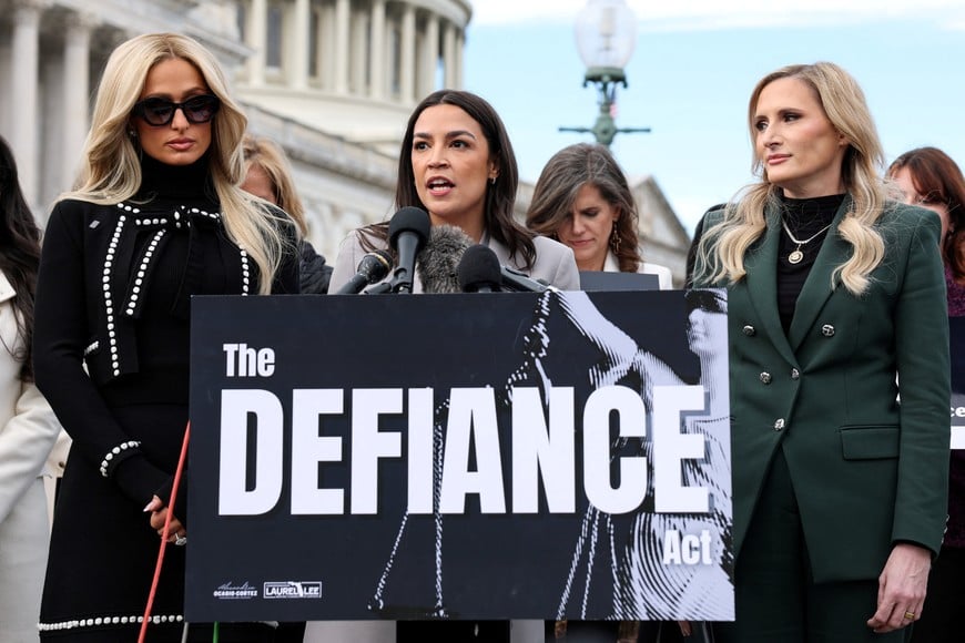 U.S. Rep. Alexandria Ocasio-Cortez (D-NY), Rep. Laurel Lee (R-FL), and Paris Hilton discuss the "Disrupt Explicit Forged Images and Non-Consensual Edits (DEFIANCE) Act" legislation during a press conference on Capitol Hill in Washington, D.C., U.S., January 22, 2026. REUTERS/Kylie Cooper     TPX IMAGES OF THE DAY