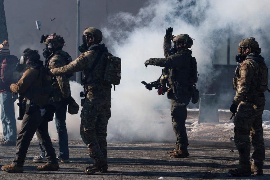 Federal agents use tear gas to disperse people gathered near the scene where federal agents fatally shot a man while trying to detain him, in Minneapolis, Minnesota, U.S., January 24, 2026. REUTERS/Evelyn Hockstein