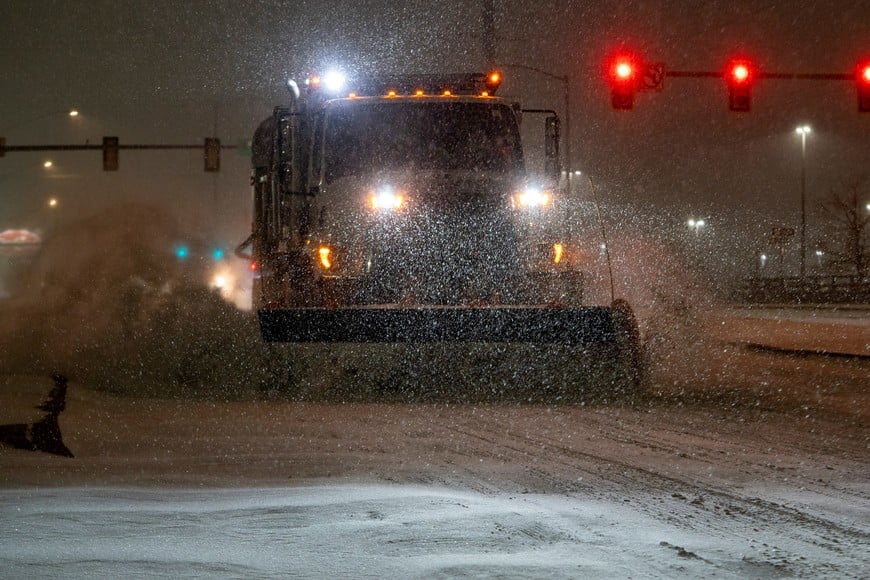 A vehicle equipped with a snowplow clears snow as Winter Storm Fern arrives in Oklahoma City, Oklahoma, U.S., January 23, 2026. REUTERS/Nick Oxford