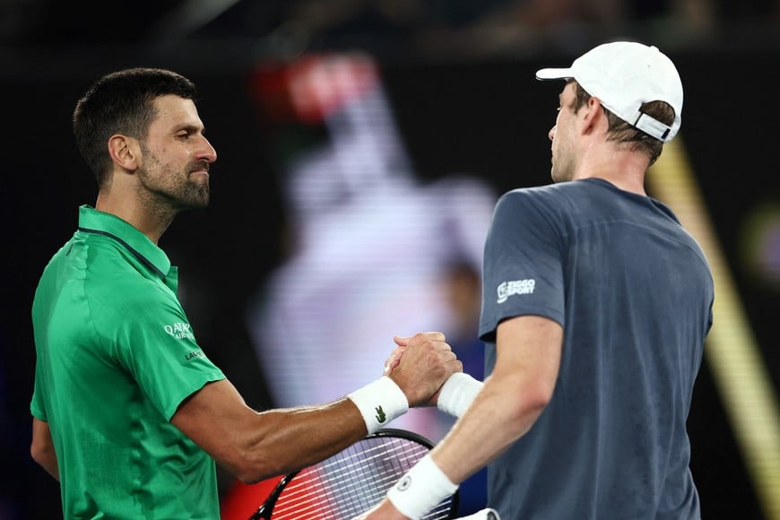 Tennis - Australian Open - Melbourne Park, Melbourne, Australia - January 24, 2026
Serbia's Novak Djokovic shakes hands with Netherlands' Botic van de Zandschulp after winning his third round match REUTERS/Tingshu Wang